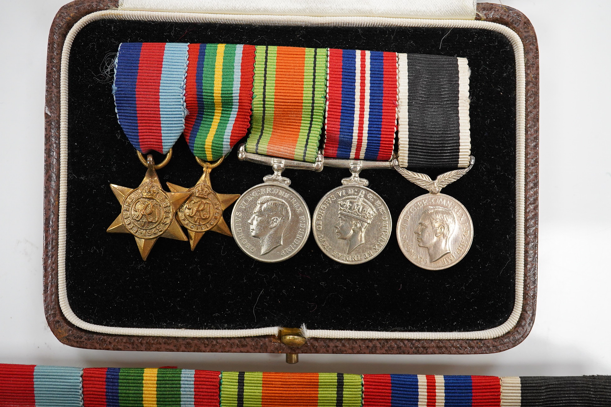 A New Zealand medal group, group of five medals including; The Service to New Zealand Medal 1939-1945, the Pacific star, the 1939 to 1945 star, etc. together with the cased miniature group. Condition - good